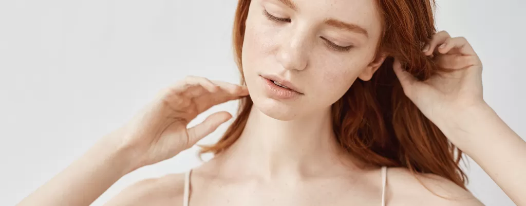 close-up-tender-redhead-girl-sleepwear-posing-with-closed-eyes.png