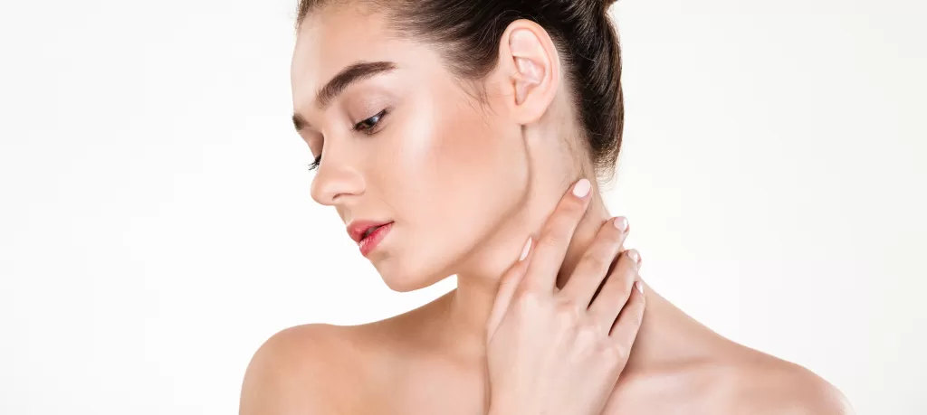 portrait-gentle-young-woman-with-healthy-body-touching-her-neck-posing-with-face-downwards.png